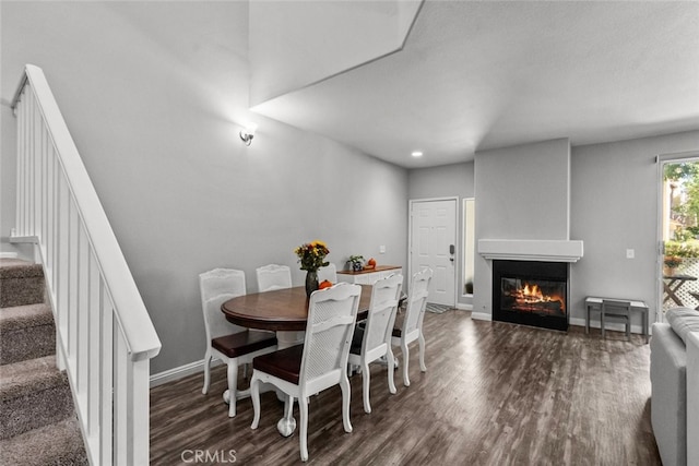 dining space featuring dark hardwood / wood-style flooring