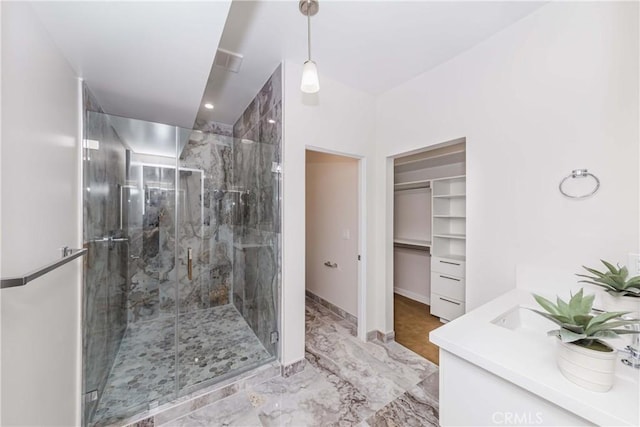 bathroom with vanity and an enclosed shower