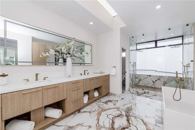 full bathroom featuring vanity, separate shower and tub, and toilet