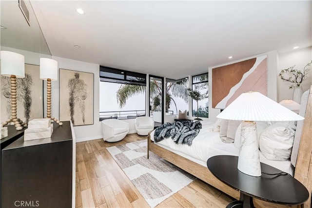 bedroom with light hardwood / wood-style floors