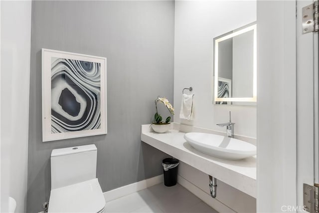 bathroom featuring sink and toilet