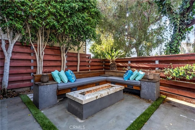 view of patio / terrace featuring a fire pit