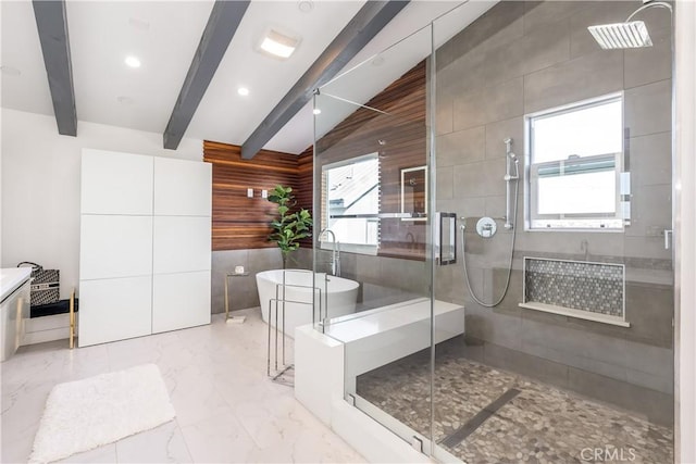 bathroom with vaulted ceiling with beams, a wealth of natural light, wooden walls, and separate shower and tub