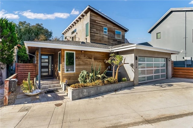 modern home featuring a garage and central AC