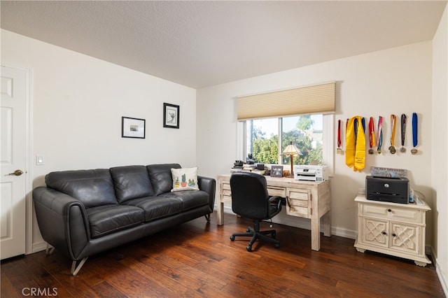 office with dark wood-type flooring