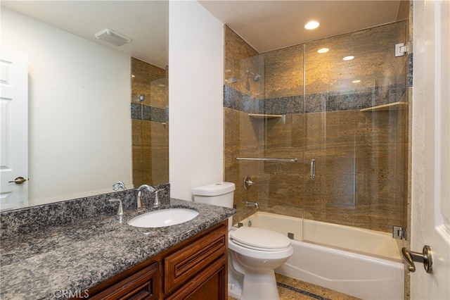 full bathroom featuring toilet, enclosed tub / shower combo, and vanity