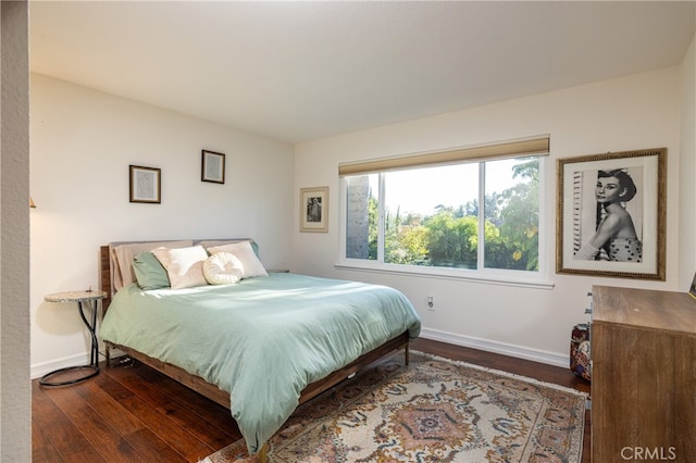 bedroom featuring dark wood-type flooring