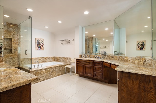 bathroom featuring vanity, shower with separate bathtub, and tile patterned floors