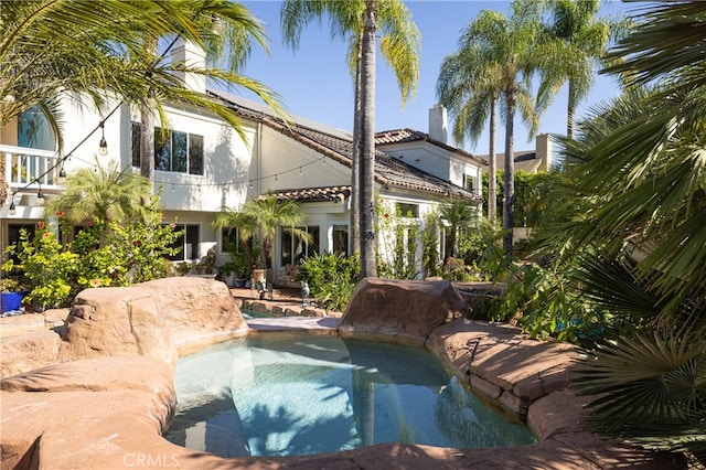 view of swimming pool with a patio area