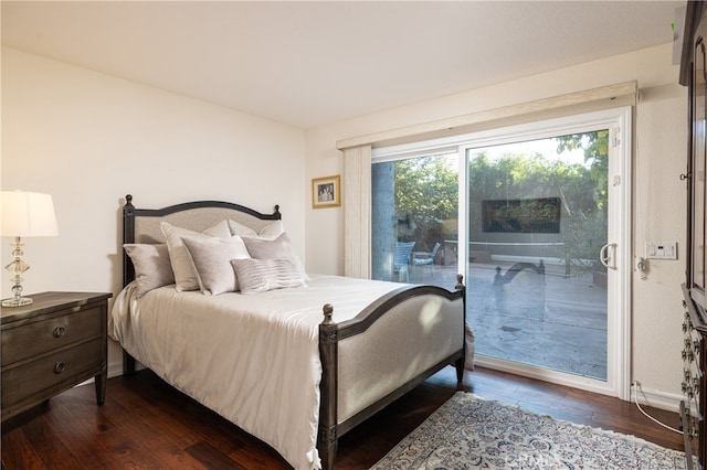 bedroom featuring access to outside and dark hardwood / wood-style floors