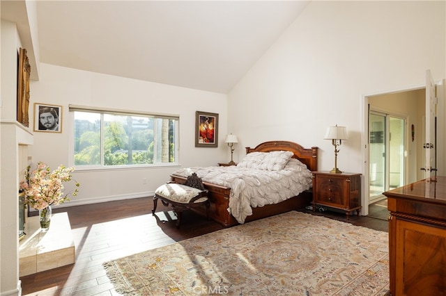 bedroom featuring hardwood / wood-style flooring and high vaulted ceiling