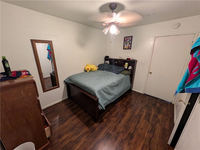 bedroom featuring ceiling fan and dark wood-type flooring