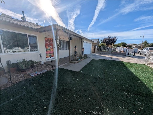 exterior space with a lawn and a garage