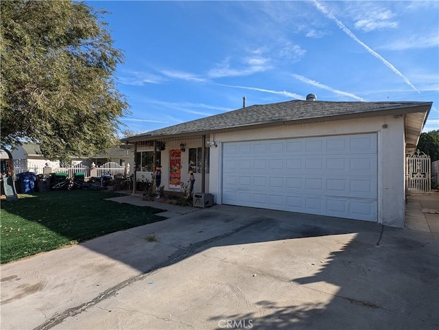 ranch-style house with a garage and a front yard