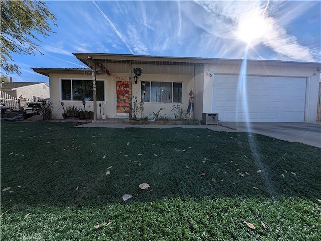 single story home with a front yard and a garage