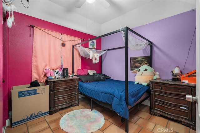 bedroom featuring ceiling fan and light tile patterned flooring