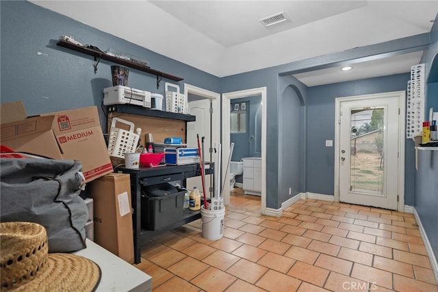 entryway with light tile patterned floors