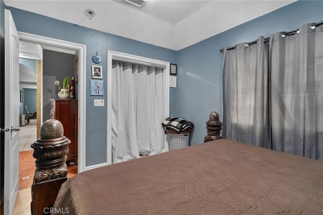 bedroom featuring light tile patterned flooring