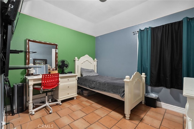 bedroom with light tile patterned floors