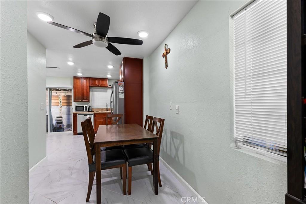 dining space featuring ceiling fan