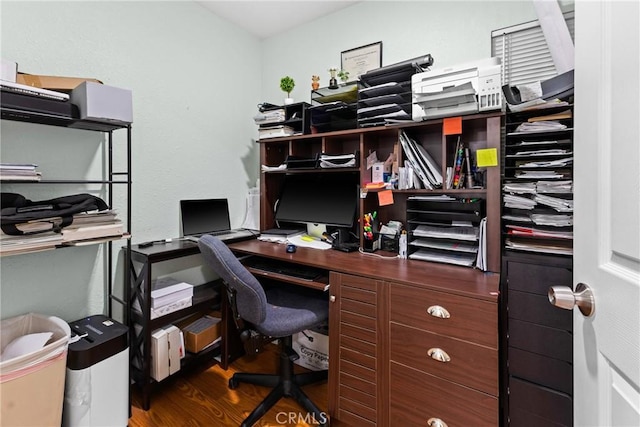 office space with dark wood-type flooring