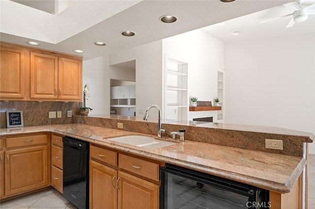 kitchen with black dishwasher, sink, wine cooler, light stone counters, and kitchen peninsula