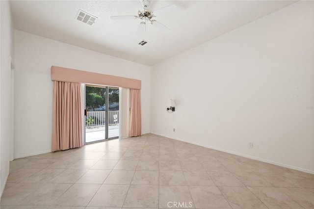 tiled empty room featuring ceiling fan