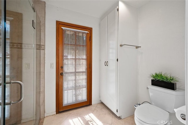 doorway to outside with light tile patterned floors