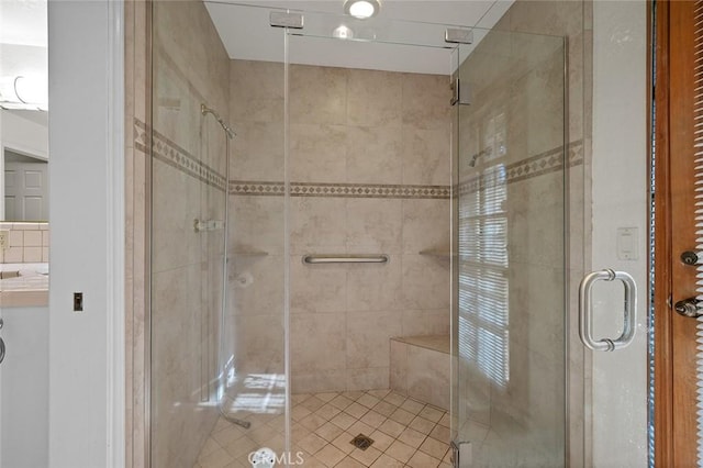 bathroom featuring a shower with shower door