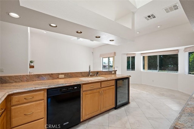 kitchen with wine cooler, light tile patterned flooring, sink, light stone counters, and dishwasher