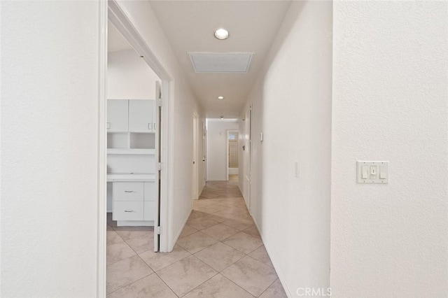 corridor with light tile patterned flooring