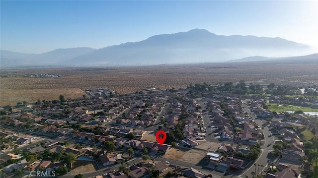 birds eye view of property with a mountain view