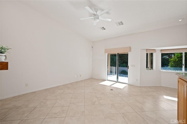 empty room featuring light tile patterned floors and ceiling fan