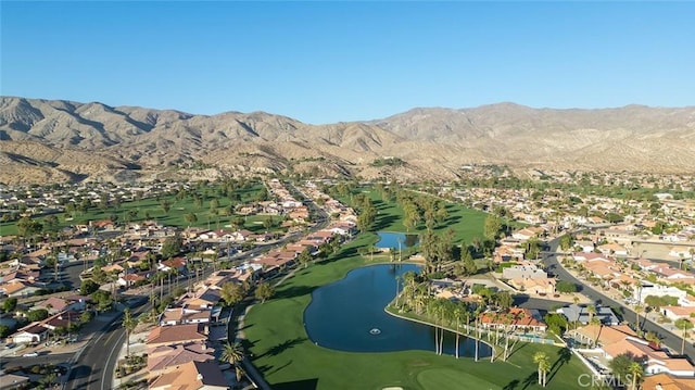 bird's eye view with a water and mountain view