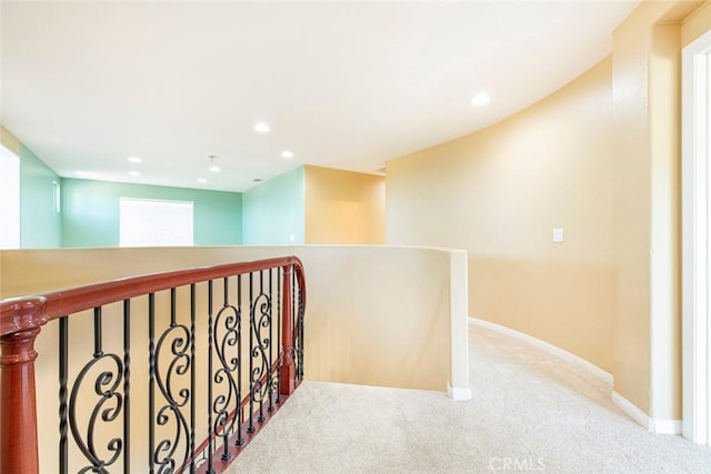 corridor with light colored carpet