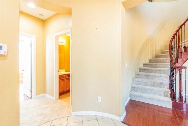 staircase featuring tile patterned floors