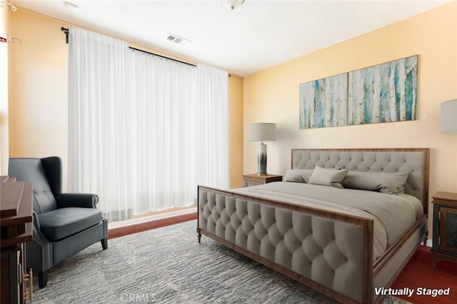 bedroom featuring dark hardwood / wood-style flooring