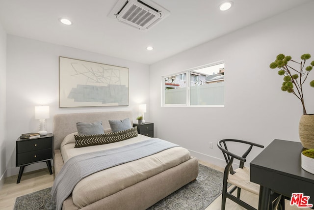 bedroom with light hardwood / wood-style flooring