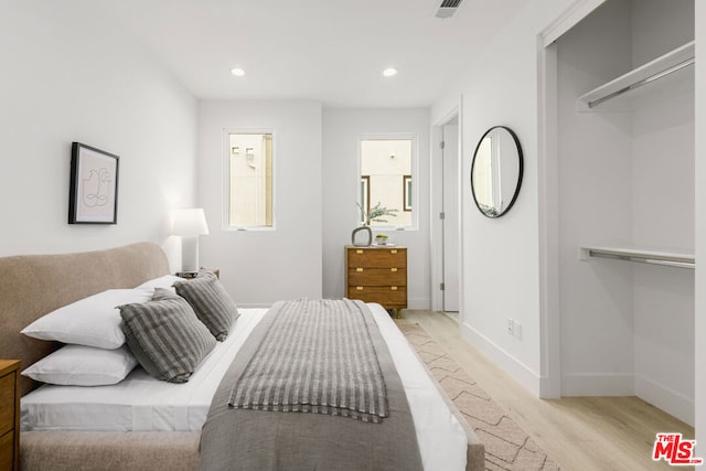 bedroom with light hardwood / wood-style flooring