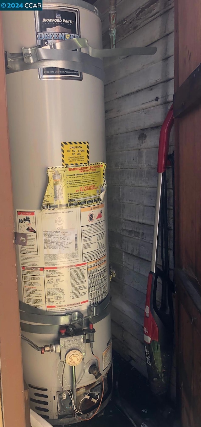 utility room with water heater