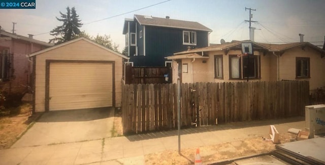 view of front of home with an outbuilding and a garage