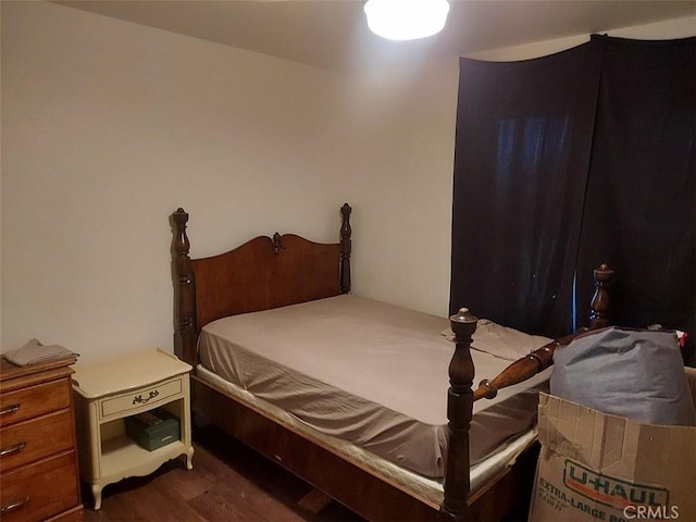 bedroom featuring dark hardwood / wood-style floors