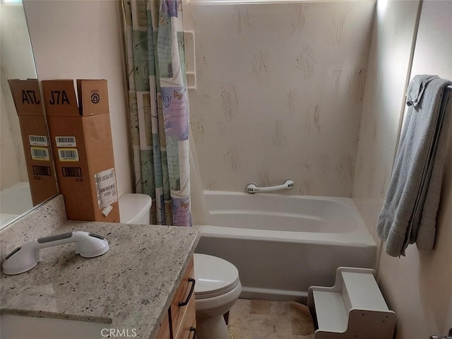 bathroom with tile patterned flooring, vanity, and toilet