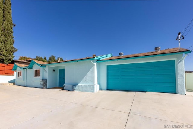 single story home featuring a garage