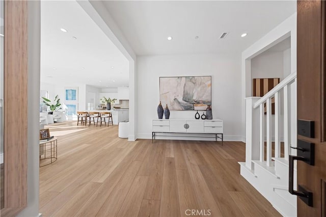 foyer entrance with light wood-type flooring