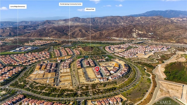 drone / aerial view featuring a mountain view