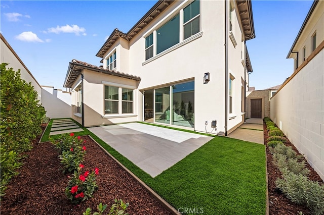 rear view of house with a patio