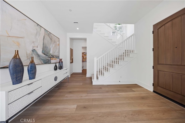 entrance foyer featuring wood-type flooring