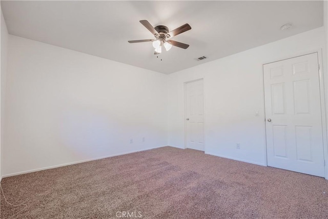 spare room with carpet flooring and ceiling fan