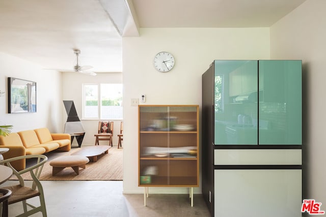 interior space with ceiling fan